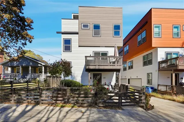 a front view of a house with sitting area
