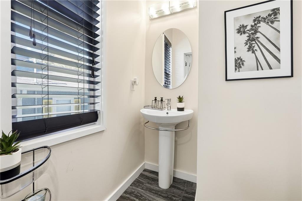 225 Crumley Street Southwest Atlanta, GA 30312 - Photo 13 of 23 a bathroom with a sink and a mirror