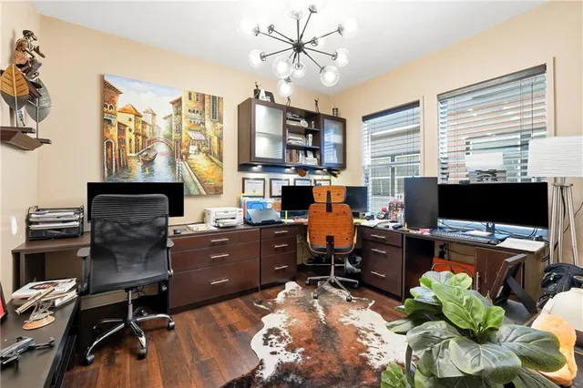 a workspace with furniture fireplace and a window