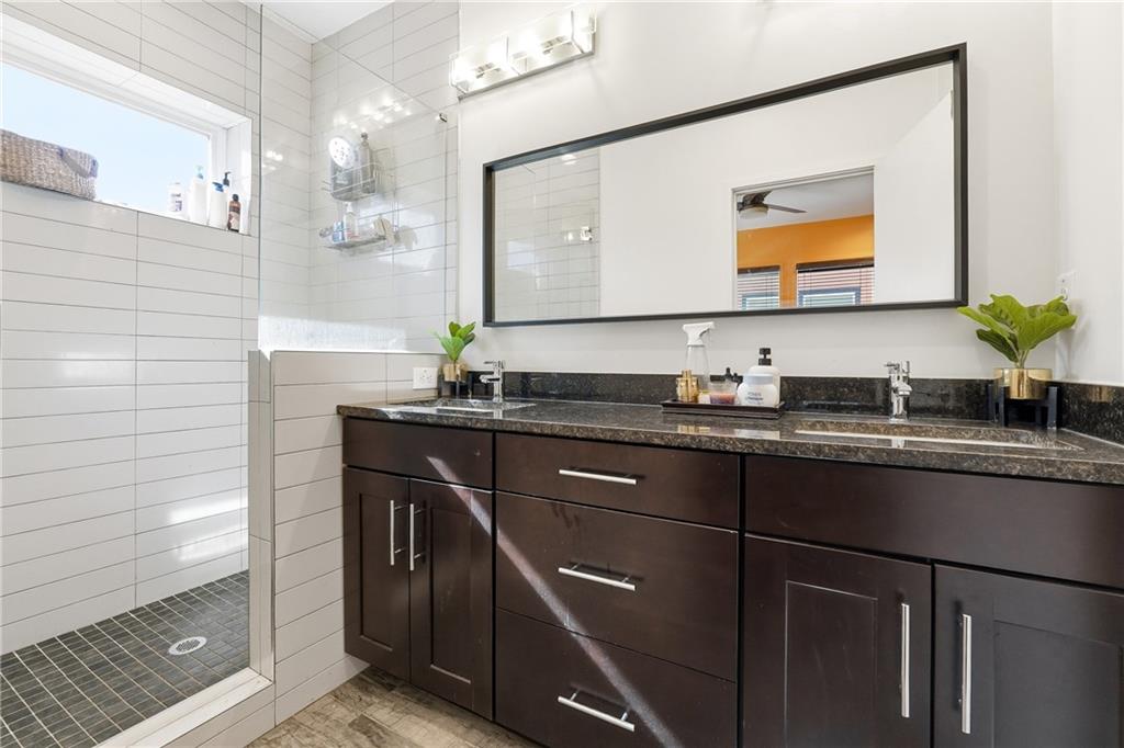 225 Crumley Street Southwest Atlanta, GA 30312 - Photo 18 of 23 a bathroom with a sink and a mirror