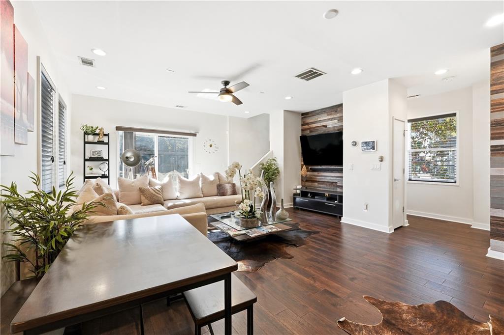 225 Crumley Street Southwest Atlanta, GA 30312 - Photo 6 of 23 a living room with fireplace furniture flat screen tv and wooden floor