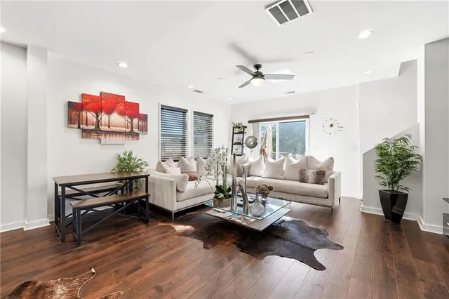 a living room with furniture or couch and a wooden floor