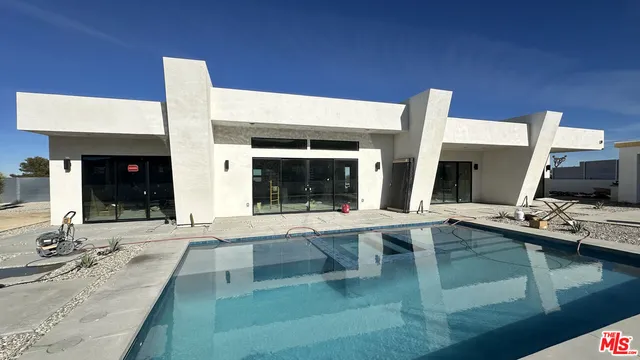 a large white building with a large window in front of it