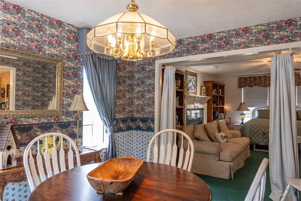 a view of a livingroom with furniture window and wooden floor