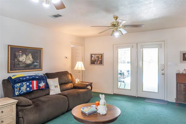 a living room with furniture and a window