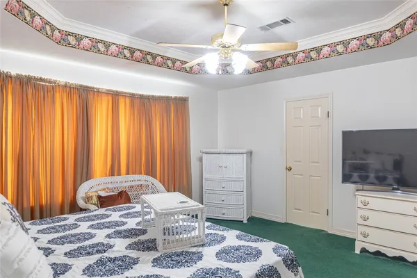 a bedroom with a bed and a dresser