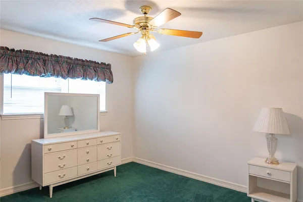 a bathroom with a sink vanity and a mirror