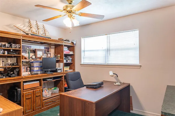 a view of a workspace with furniture