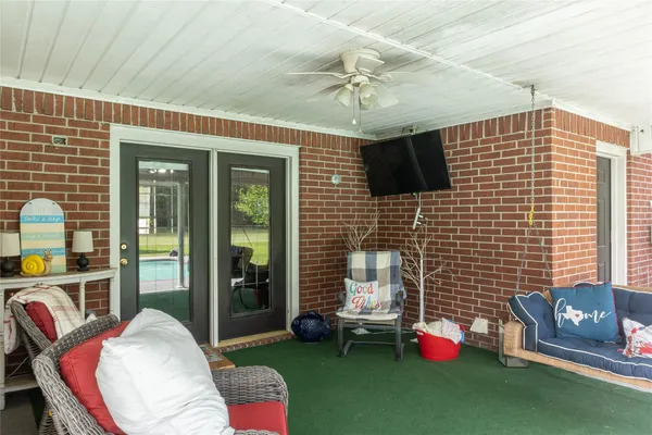 a bedroom with furniture and a window