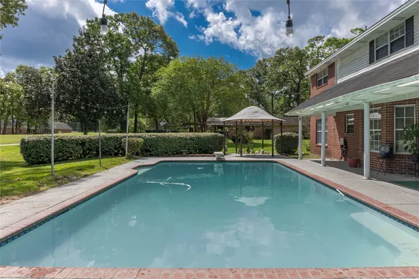 a view of a swimming pool with a patio