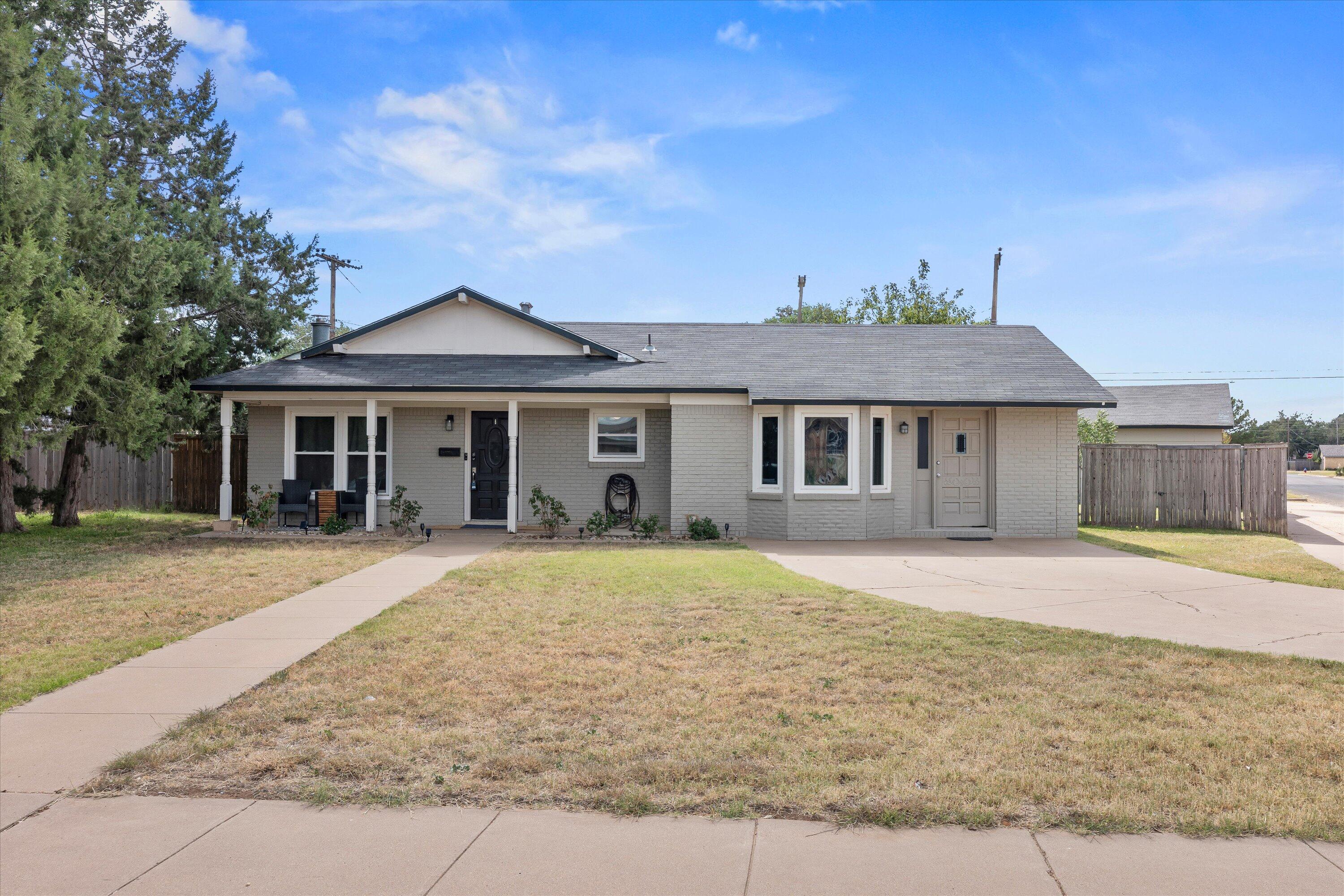 5305 13th Street Lubbock, TX 79416 - Photo 1 of 31 front view of a house with a yard