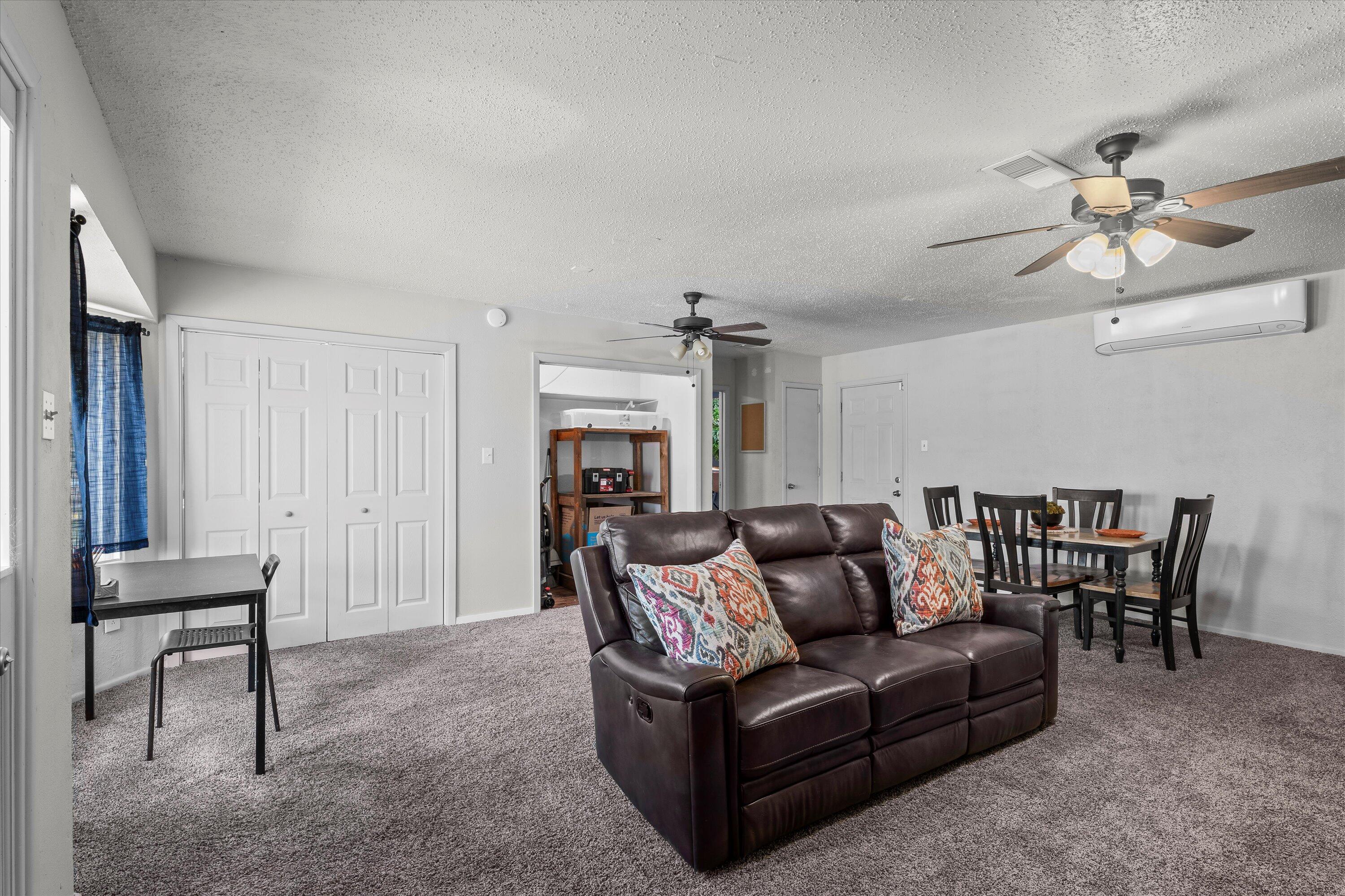 5305 13th Street Lubbock, TX 79416 - Photo 22 of 31 a living room with furniture and a fireplace