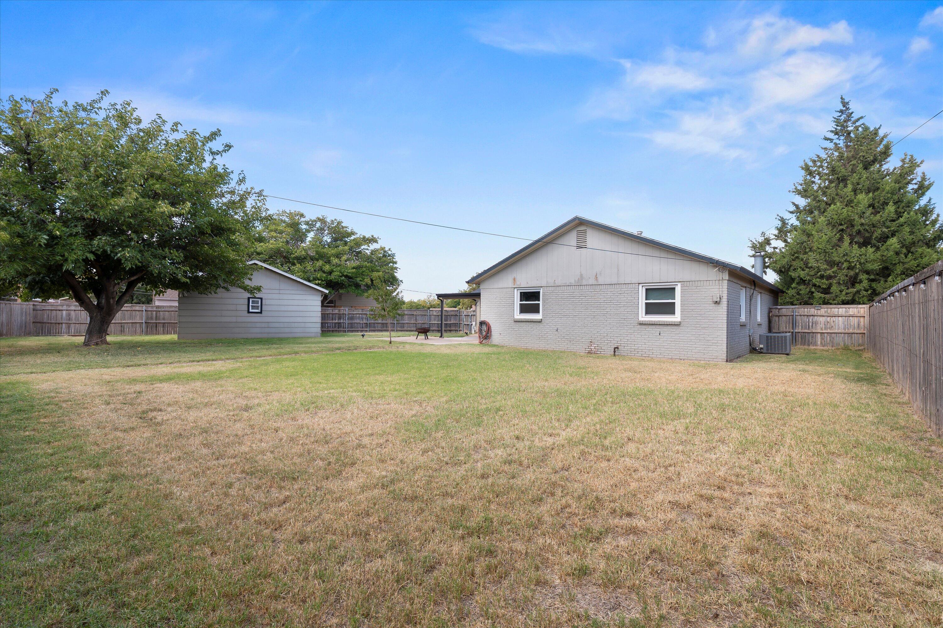 5305 13th Street Lubbock, TX 79416 - Photo 28 of 31 a view of a house with backyard and garden