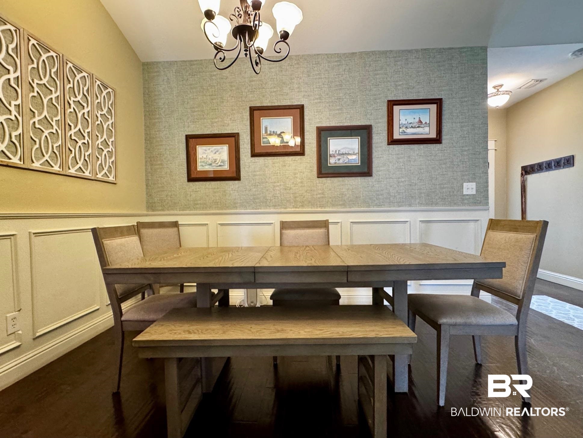 1030 Crown Walk Drive Foley, AL 36535 - Photo 5 of 40 Dining space with wallpapered walls, a notable chandelier, visible vents, and wainscoting