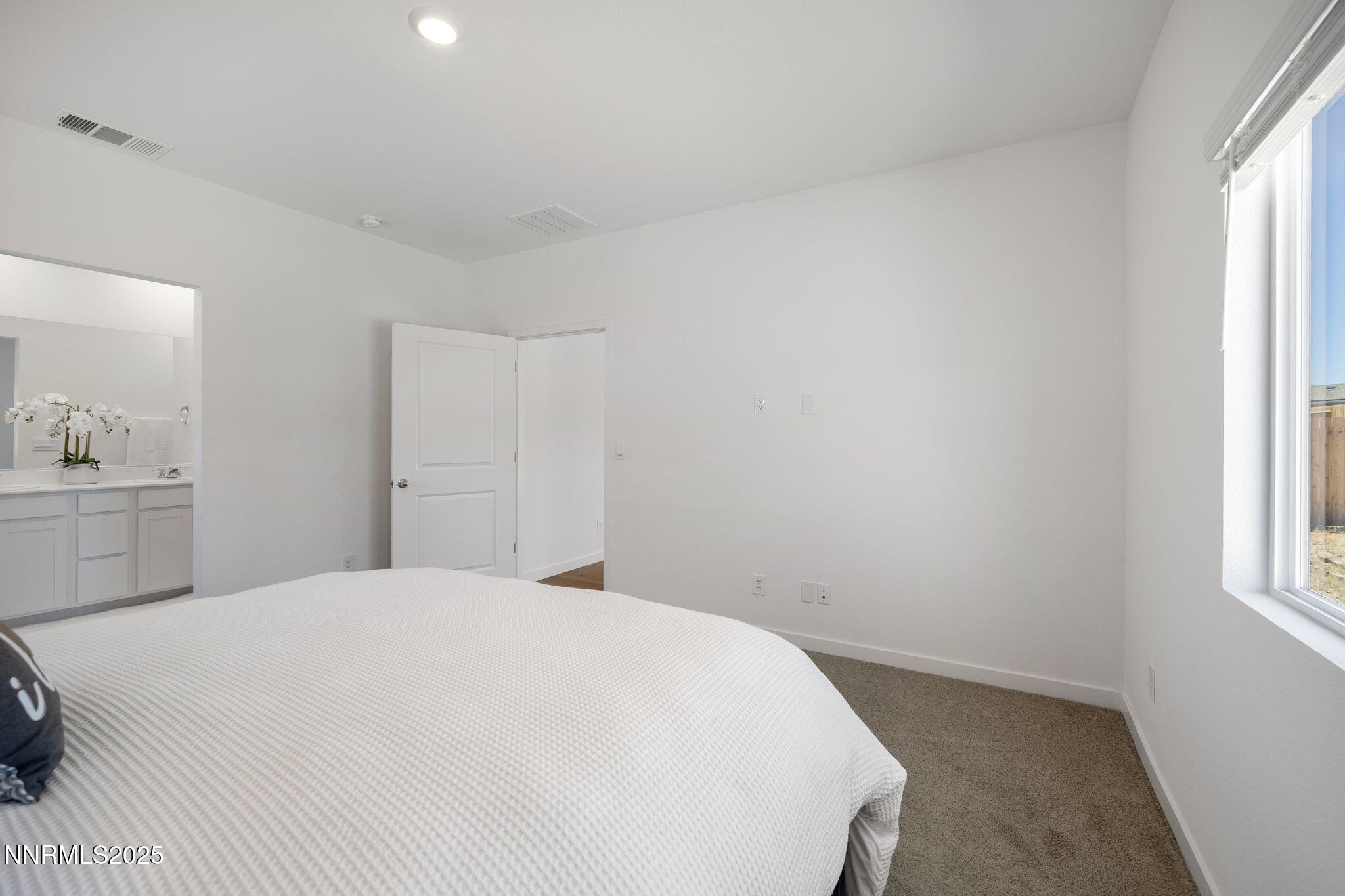 847 Schell Crk Drive Dayton, NV 89403 - Photo 14 of 31 a bedroom with a bed and a window