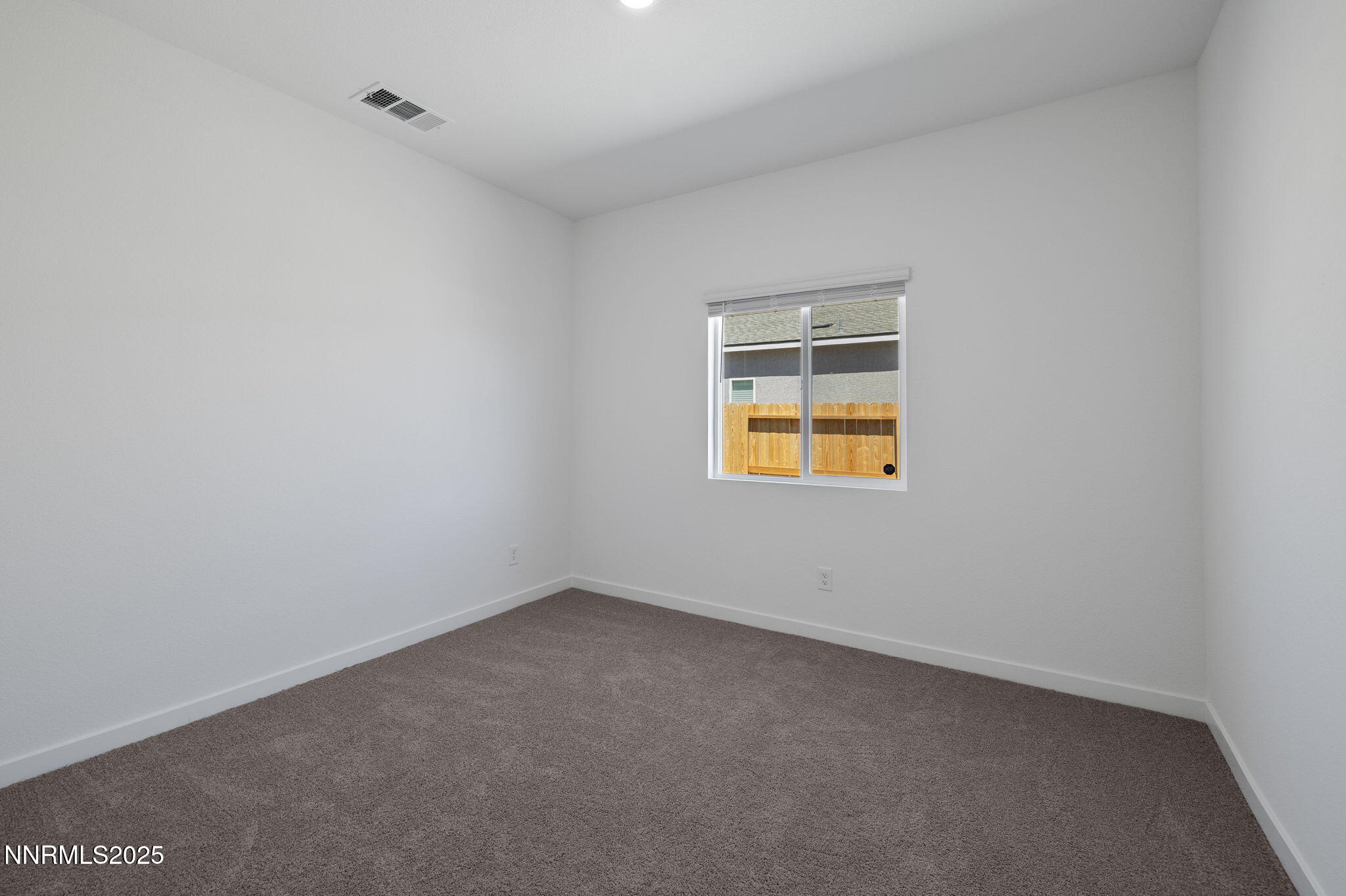 847 Schell Crk Drive Dayton, NV 89403 - Photo 21 of 31 a view of an empty room with a window