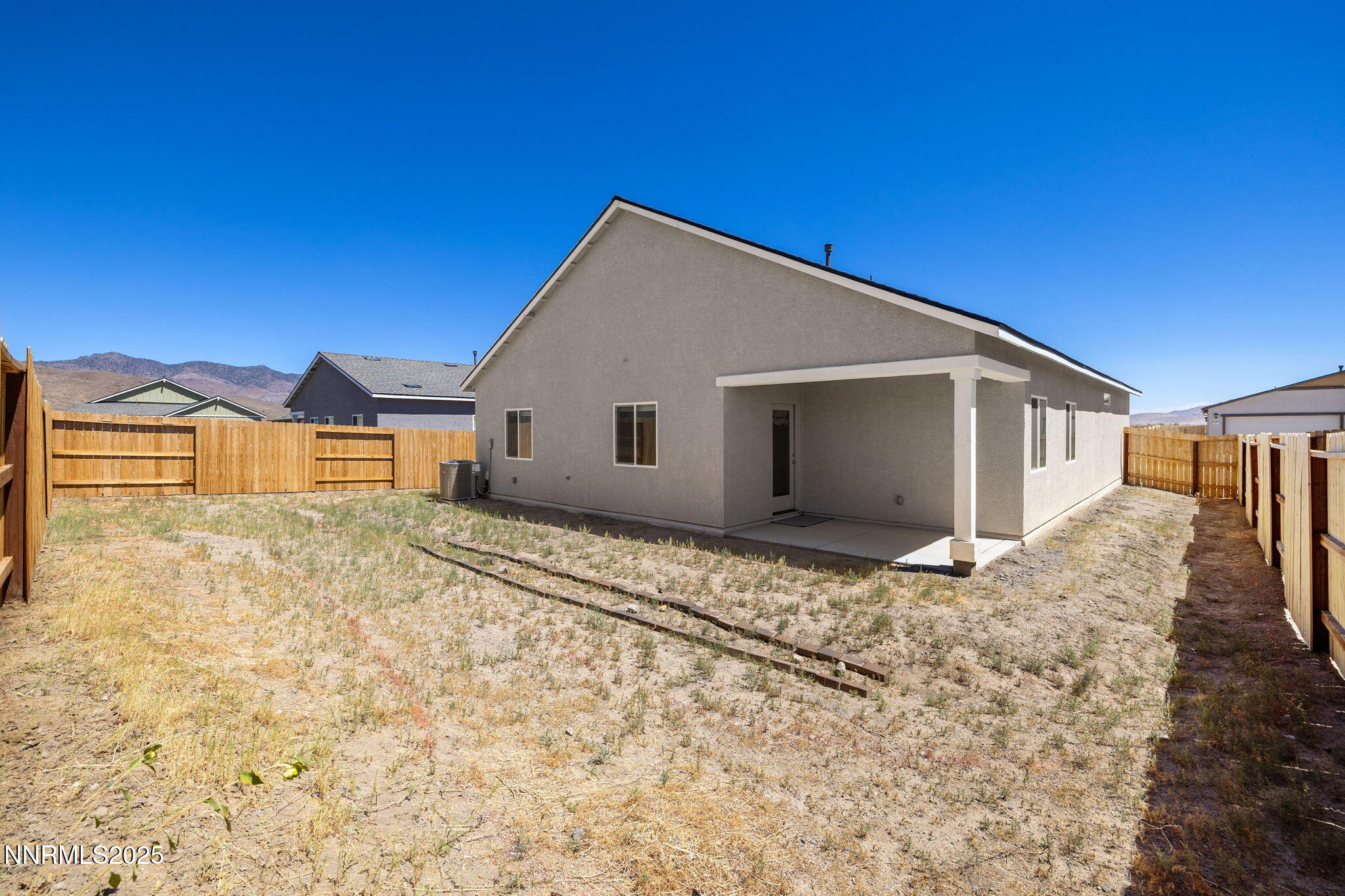 847 Schell Crk Drive Dayton, NV 89403 - Photo 29 of 31 a view of yellow house with a yard