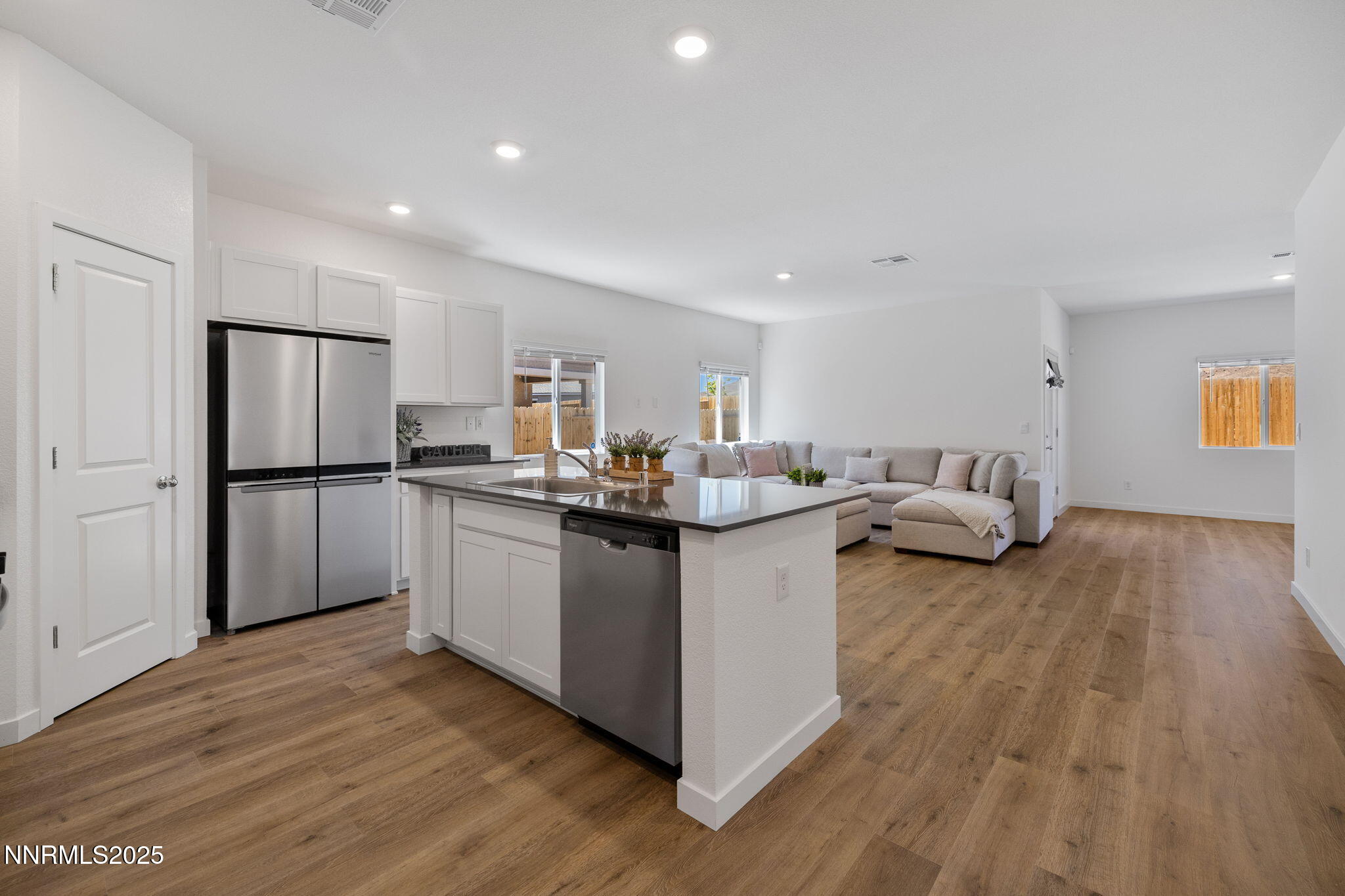 847 Schell Crk Drive Dayton, NV 89403 - Photo 7 of 31 a kitchen with sink refrigerator and cabinets