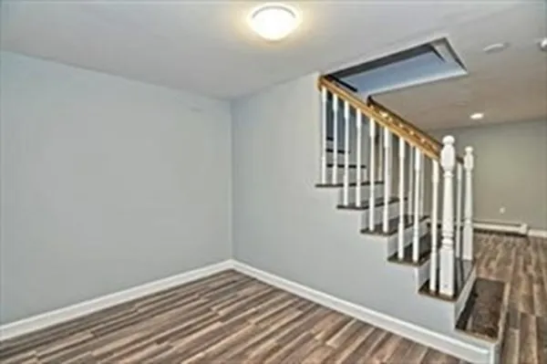 a view of an empty room with stairs