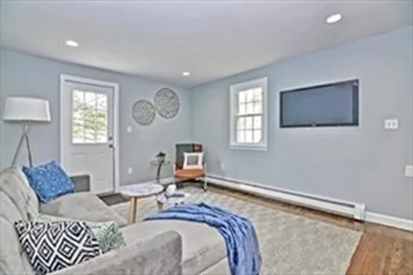 a living room with furniture and a window