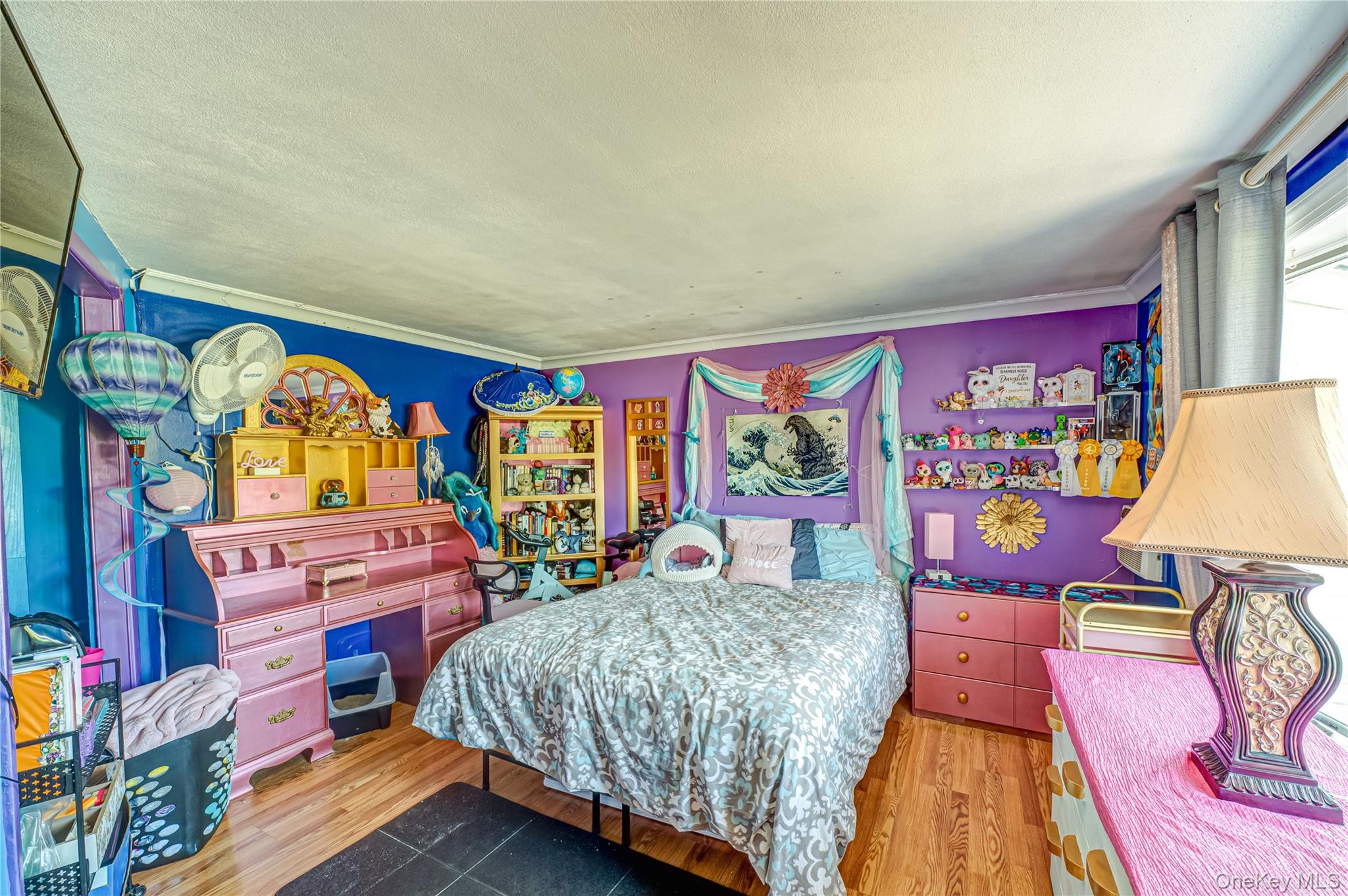 8 Woodbrook Drive, Unit 8 Ridge, NY 11961 - Photo 12 of 30 a bedroom with a bed and wooden floor