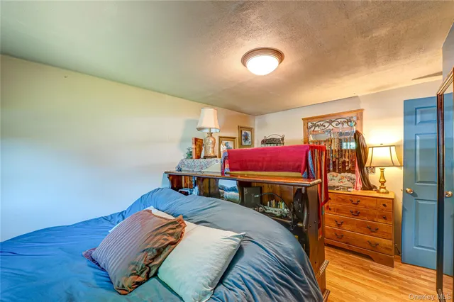 a bed room with a bed and a television