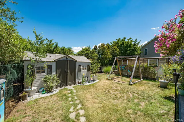 a view of a house with backyard porch and sitting area