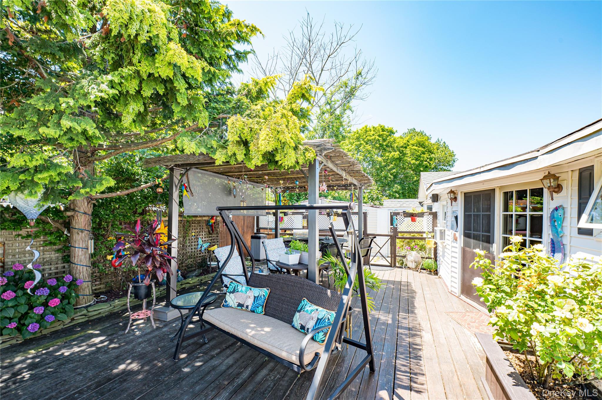 8 Woodbrook Drive, Unit 8 Ridge, NY 11961 - Photo 23 of 30 a view of a balcony with wooden floor