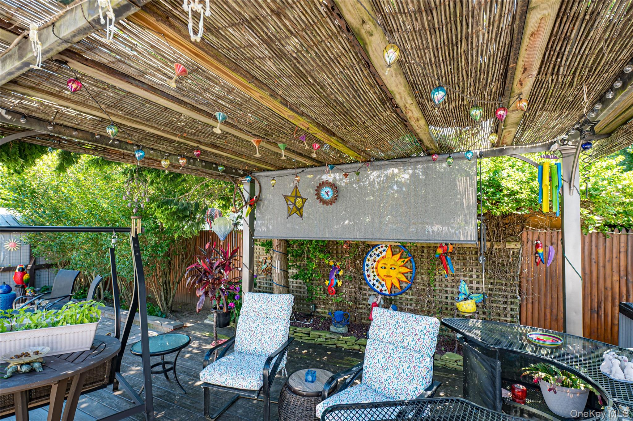 8 Woodbrook Drive, Unit 8 Ridge, NY 11961 - Photo 25 of 30 a outdoor living space with furniture and garden view