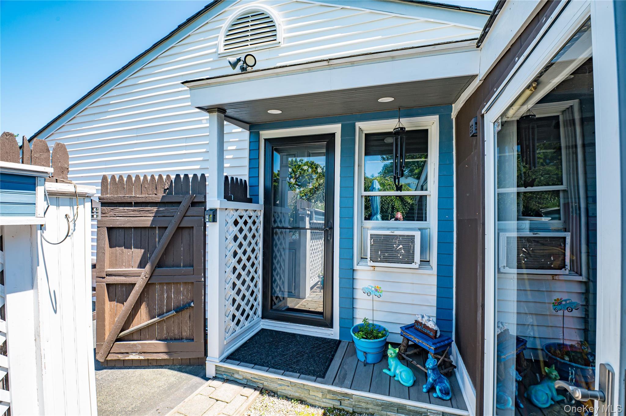 8 Woodbrook Drive, Unit 8 Ridge, NY 11961 - Photo 30 of 30 a view of an entryway door of the house