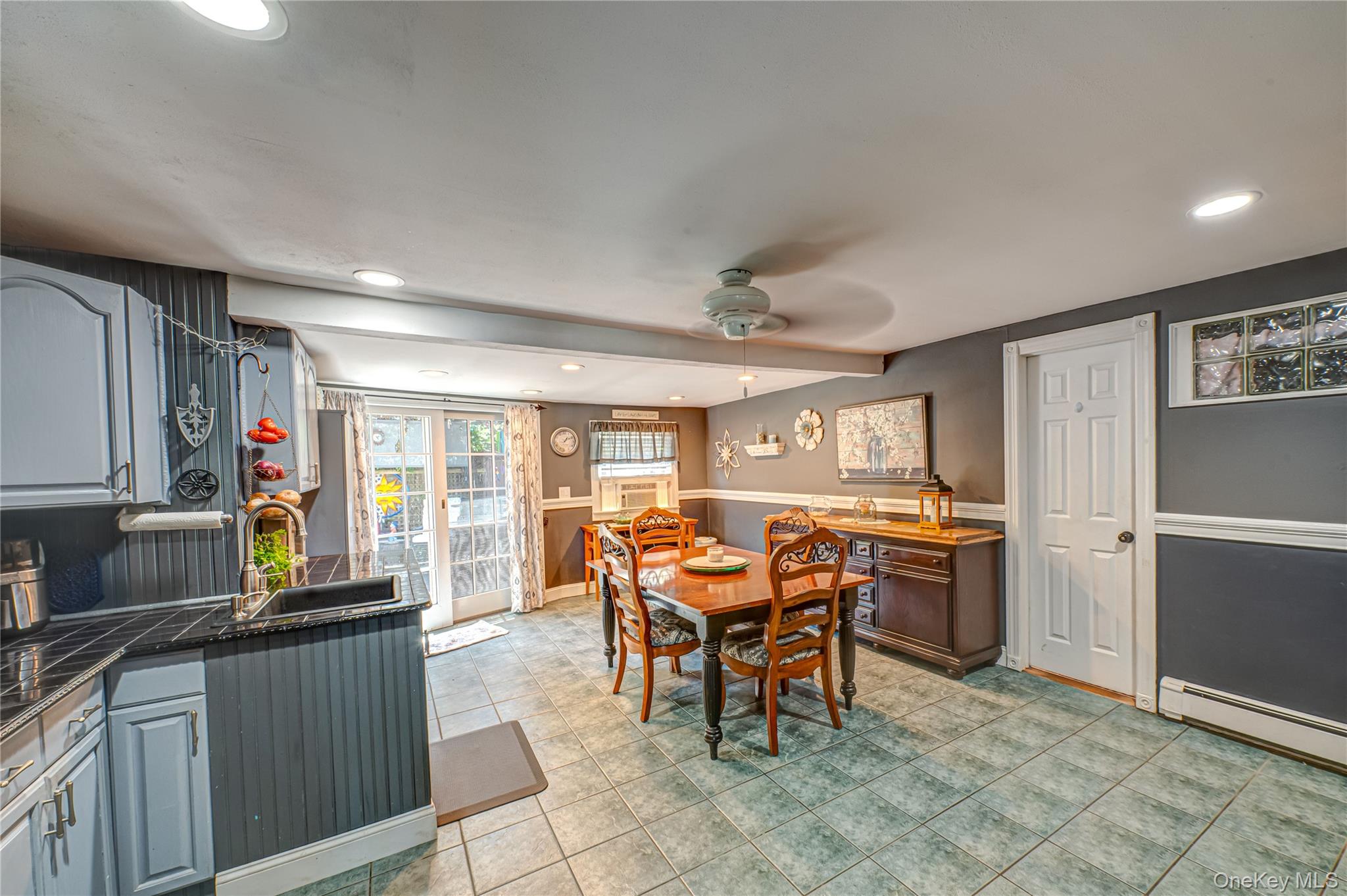 8 Woodbrook Drive, Unit 8 Ridge, NY 11961 - Photo 6 of 30 a view of a dining room with furniture