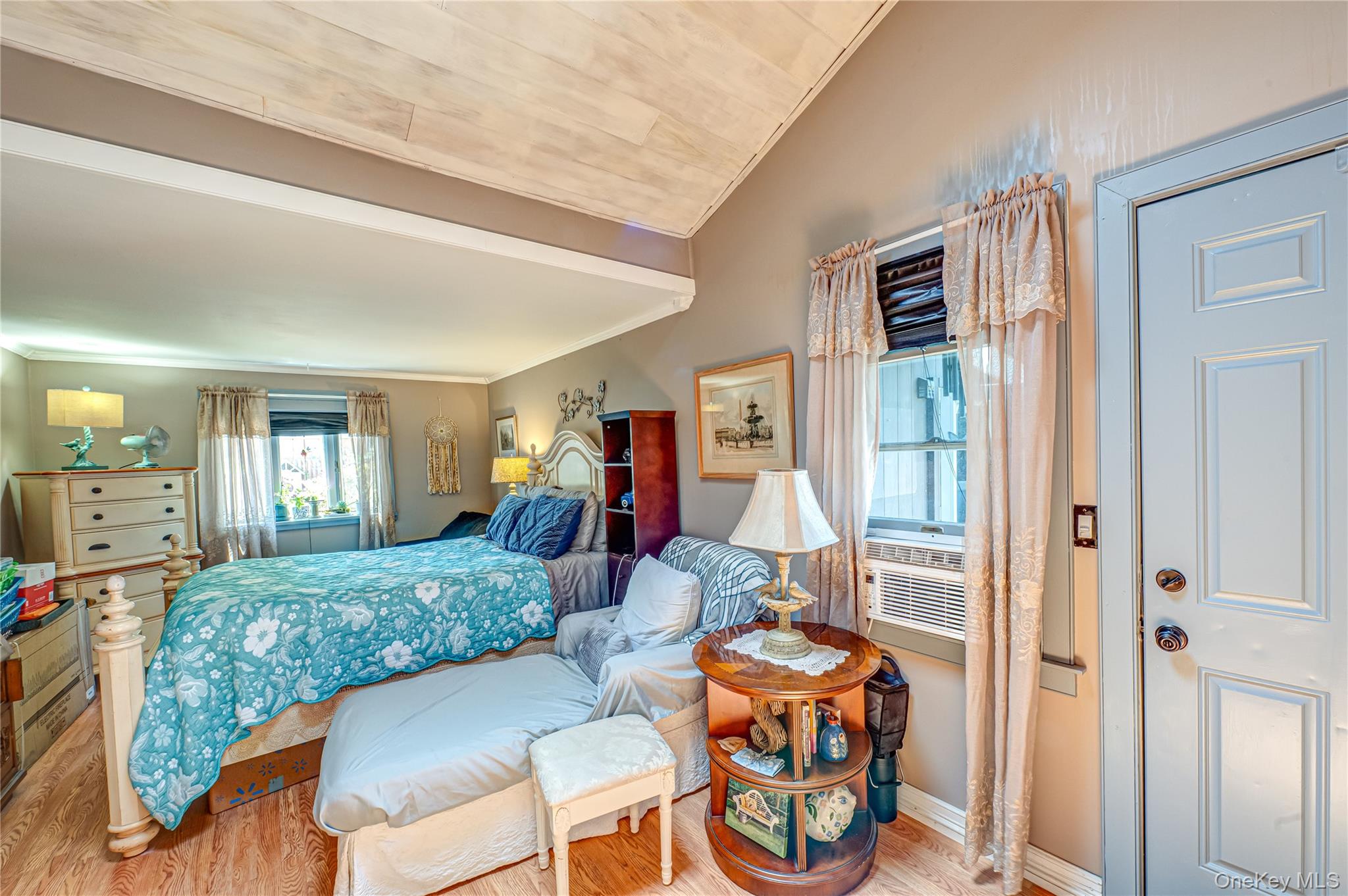 8 Woodbrook Drive, Unit 8 Ridge, NY 11961 - Photo 9 of 30 a living room with furniture and a table