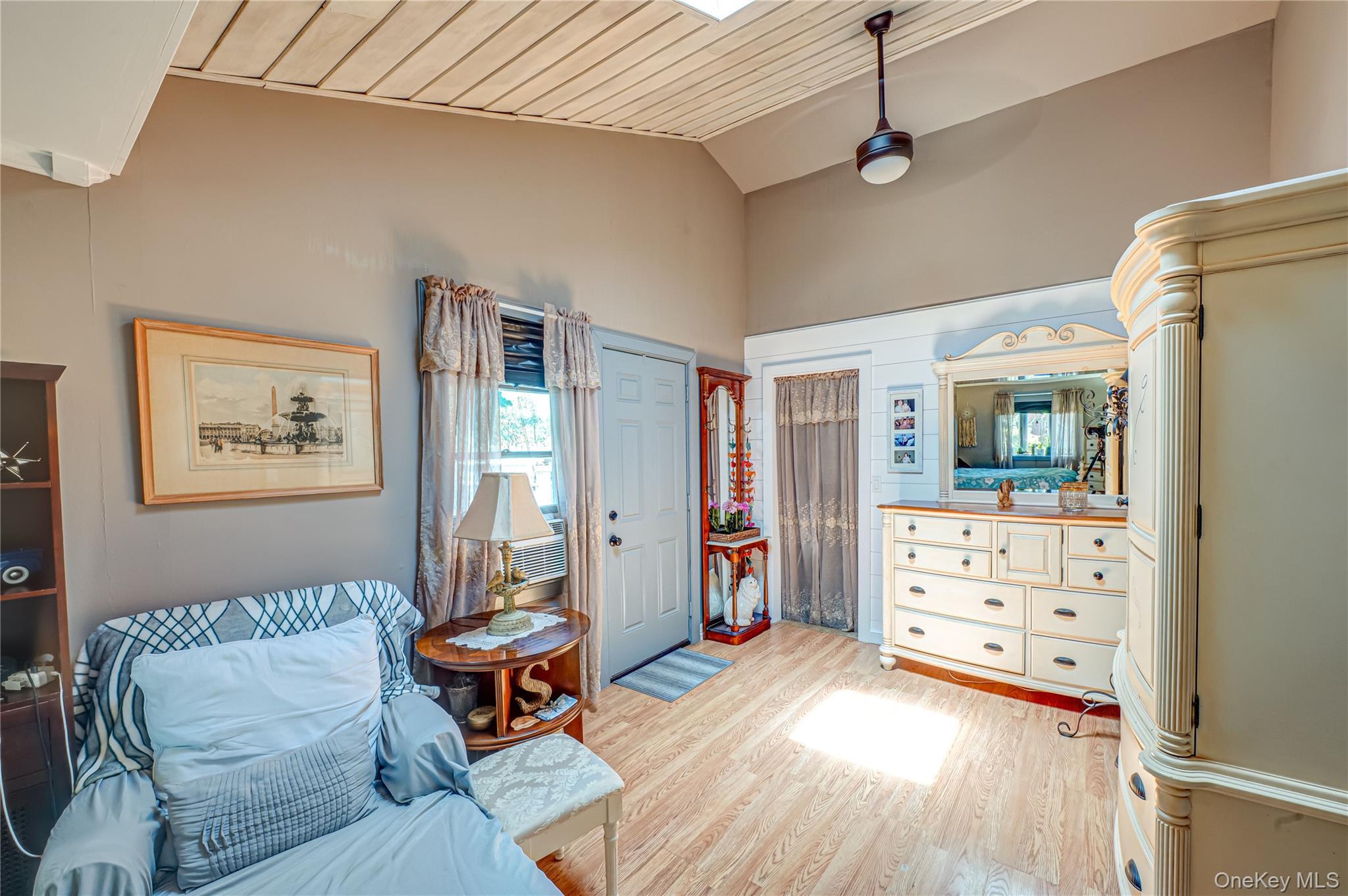 8 Woodbrook Drive, Unit 8 Ridge, NY 11961 - Photo 10 of 30 a living room with furniture and a flat screen tv
