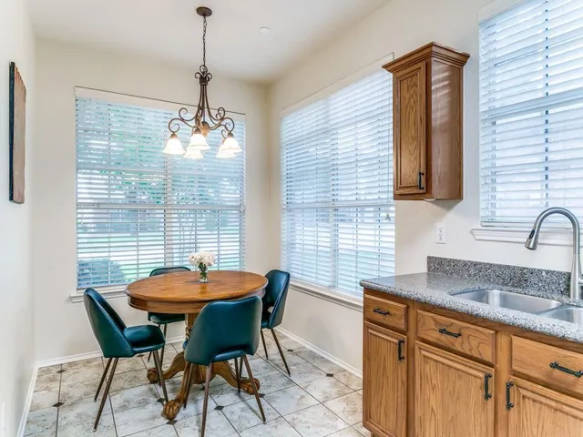 a table and chairs in a kitchen