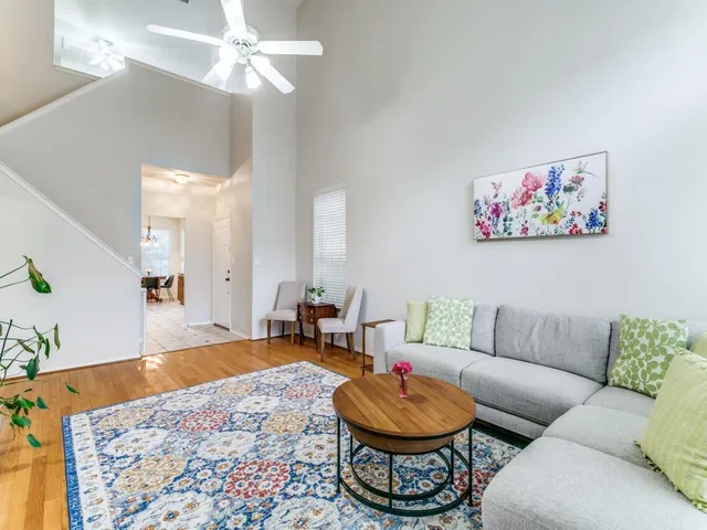 a living room with furniture and a rug