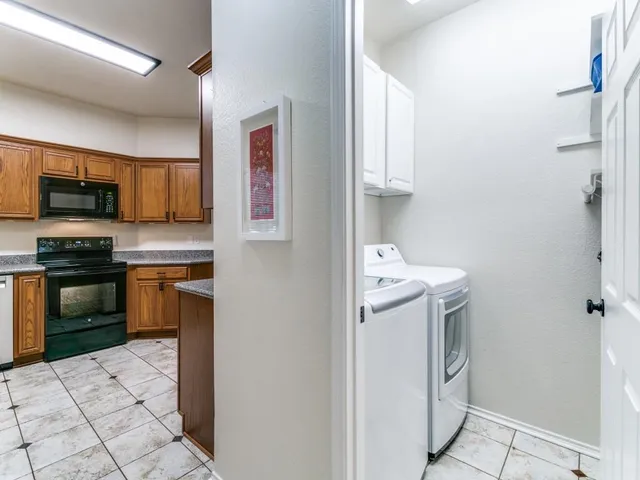 a kitchen with a sink and a stove top oven