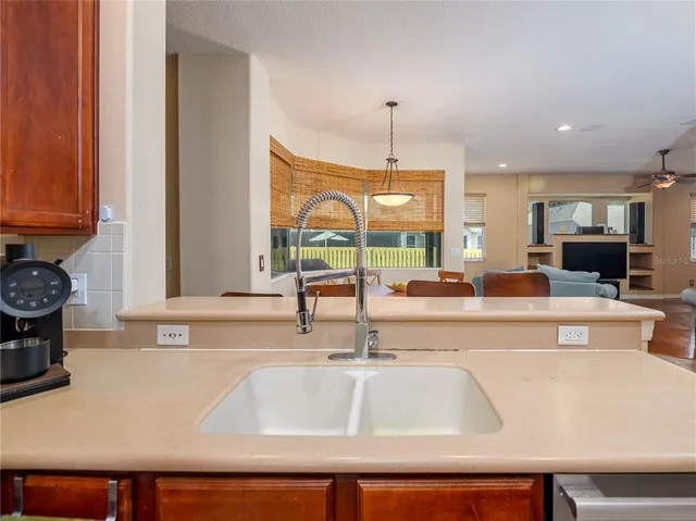 a view of living room with granite countertop furniture and a fireplace