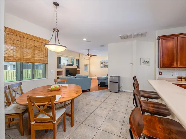 a dining room with furniture and window