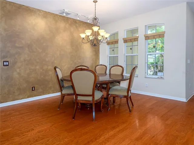 a dining room with furniture and window