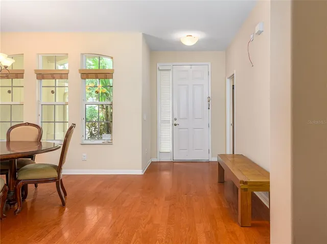 a view of a livingroom with furniture and a window