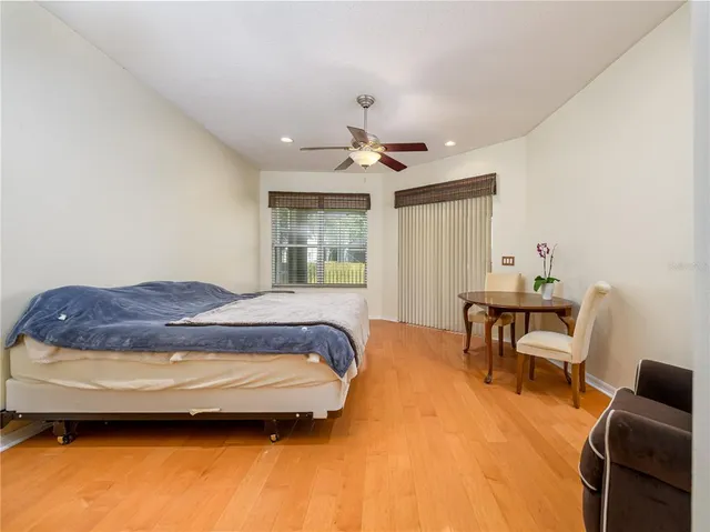 a spacious bedroom with a bed and a couch