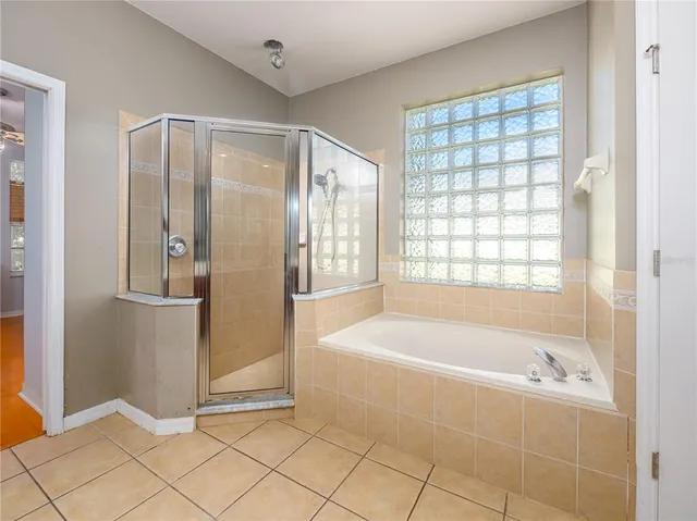 a bathroom with a bathtub and a shower