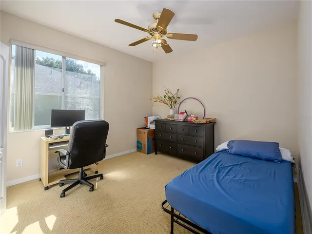 a workspace with furniture and chandelier