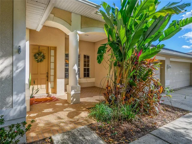 a view of a house with a tree