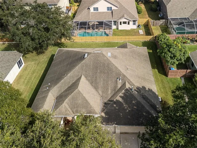 an aerial view of a house with outdoor space