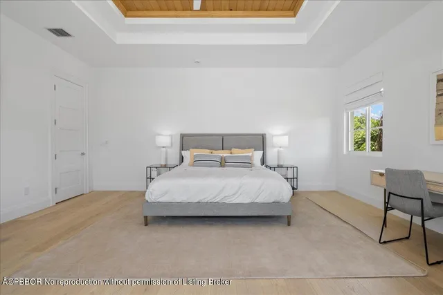 a bedroom with a bed and chair