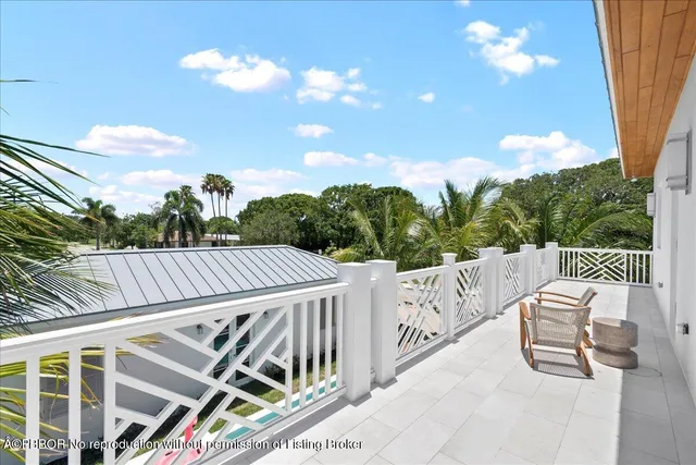 a view of balcony with wooden floor and outdoor seating