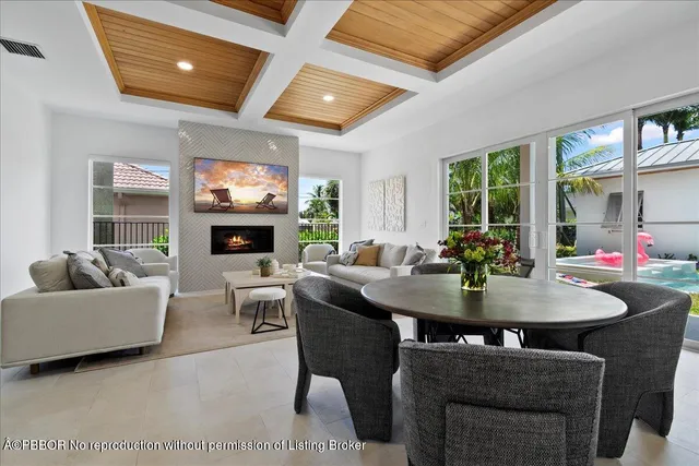 a view of a dining room with furniture and window
