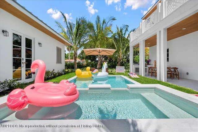 a view of a swimming pool with an outdoor seating
