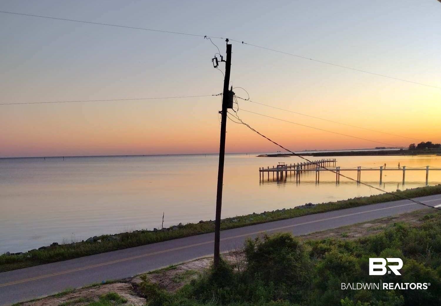 9100 Shell Belt Road Coden, AL 36523 - Photo 36 of 38 Waterfront setting featuring an extensive pier structure and a tranquil body of water